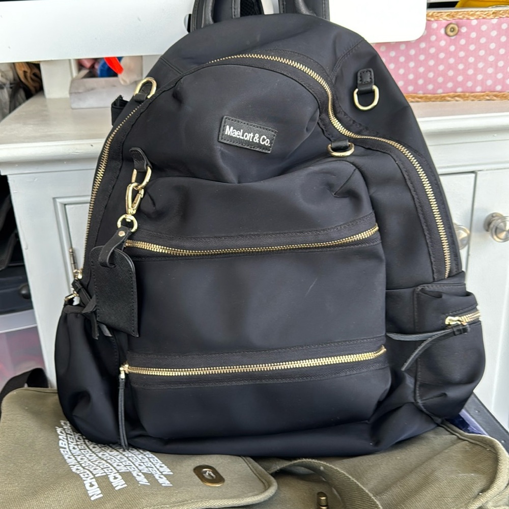 Black Backpack with Gold Accents